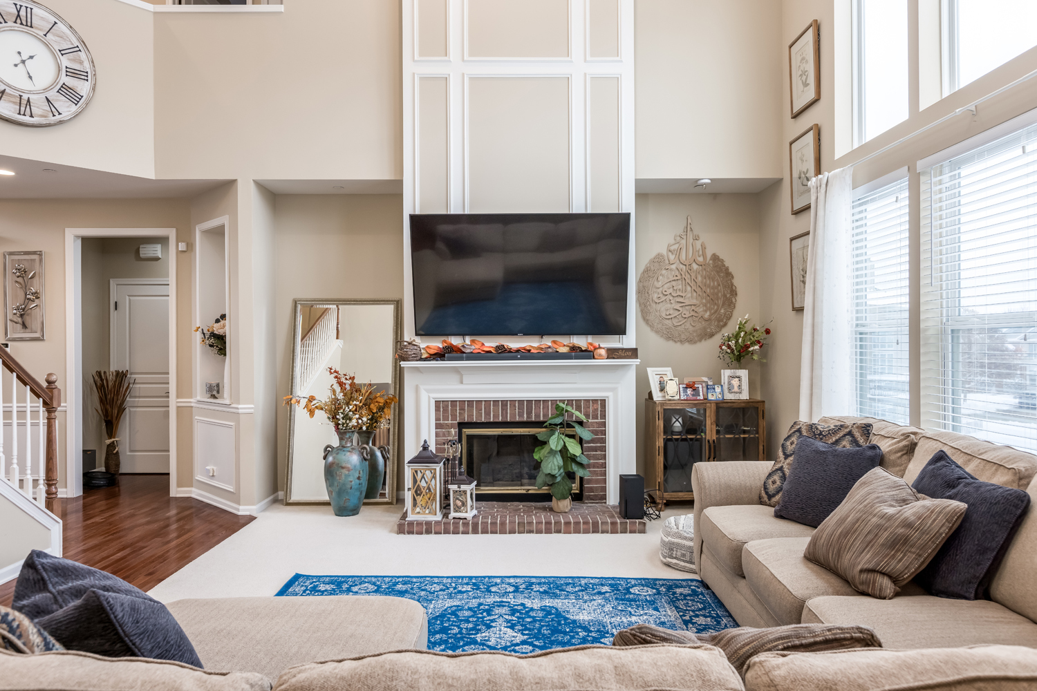 908 Blue Ridge Drive Streamwood, IL 60107 - Photo 17 of 48 a living room with furniture a flat screen tv and a fireplace