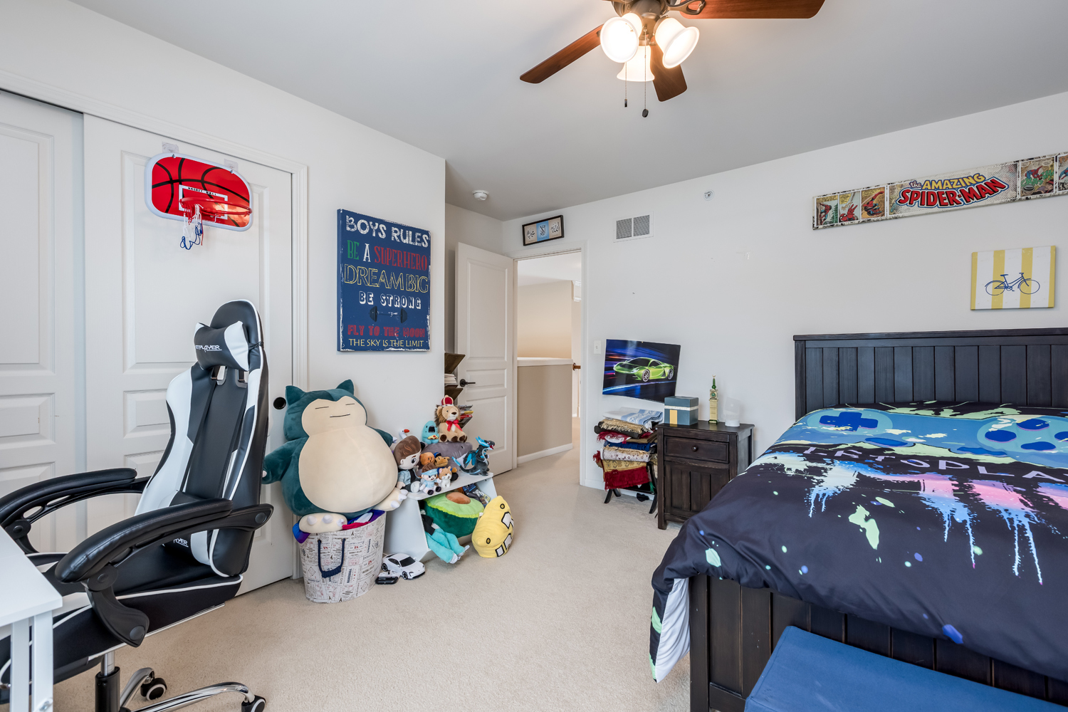 908 Blue Ridge Drive Streamwood, IL 60107 - Photo 24 of 48 a bedroom with a bed and a chandelier