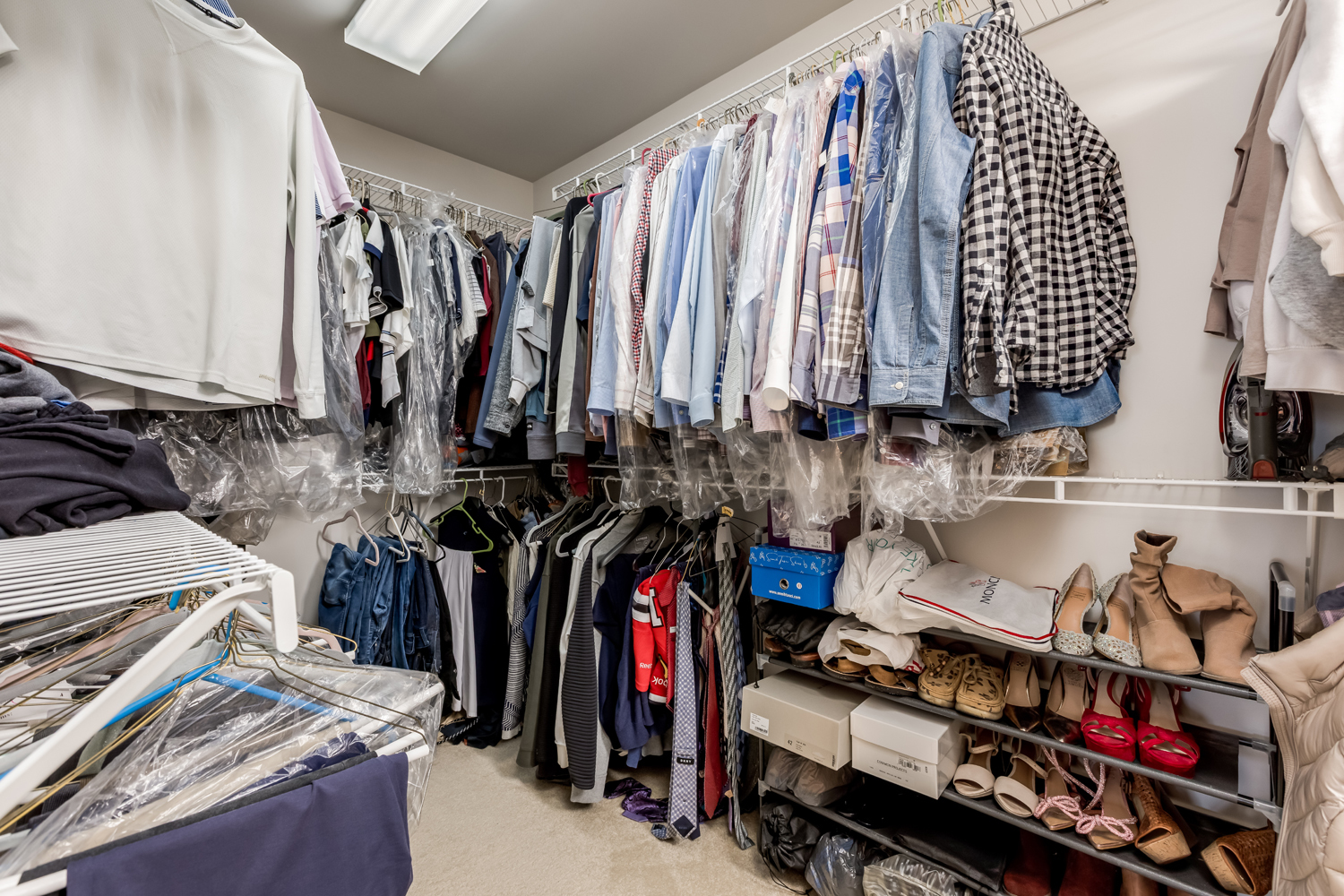 908 Blue Ridge Drive Streamwood, IL 60107 - Photo 30 of 48 a view of walk in closet with clothes and shoes
