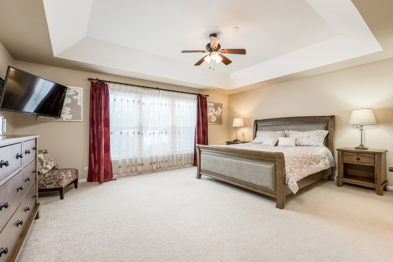 908 Blue Ridge Drive Streamwood, IL 60107 - Photo 32 of 48 a spacious bedroom with a bed and a chandelier
