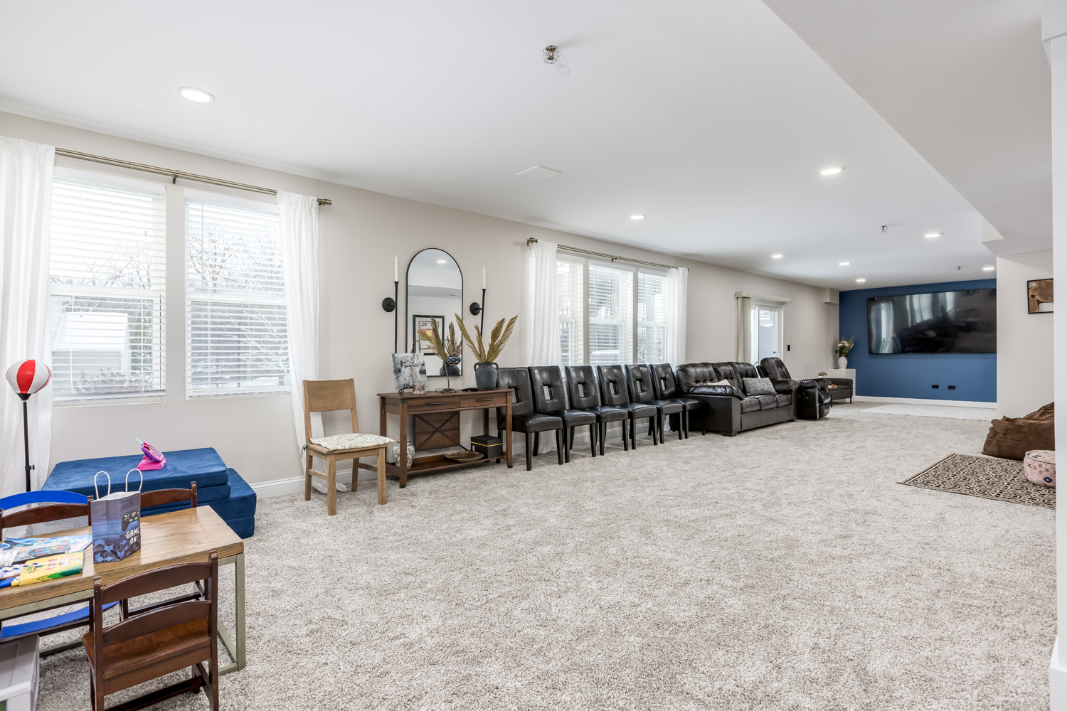 908 Blue Ridge Drive Streamwood, IL 60107 - Photo 43 of 48 a large room with lots of furniture and windows
