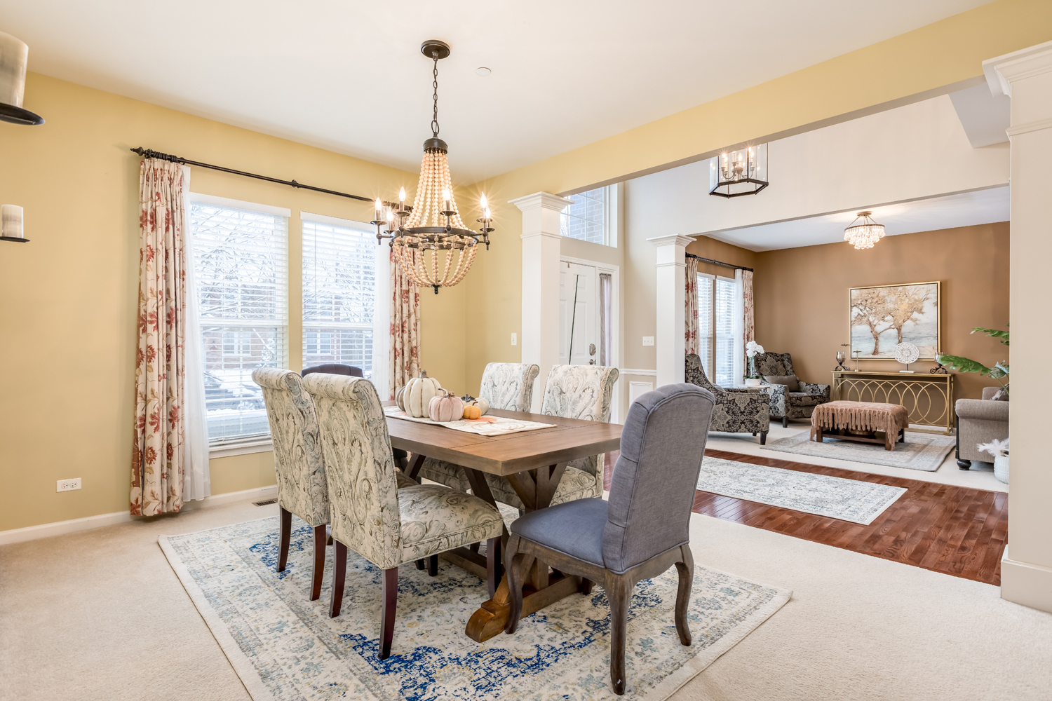 908 Blue Ridge Drive Streamwood, IL 60107 - Photo 6 of 48 a dining room with furniture a chandelier and wooden floor