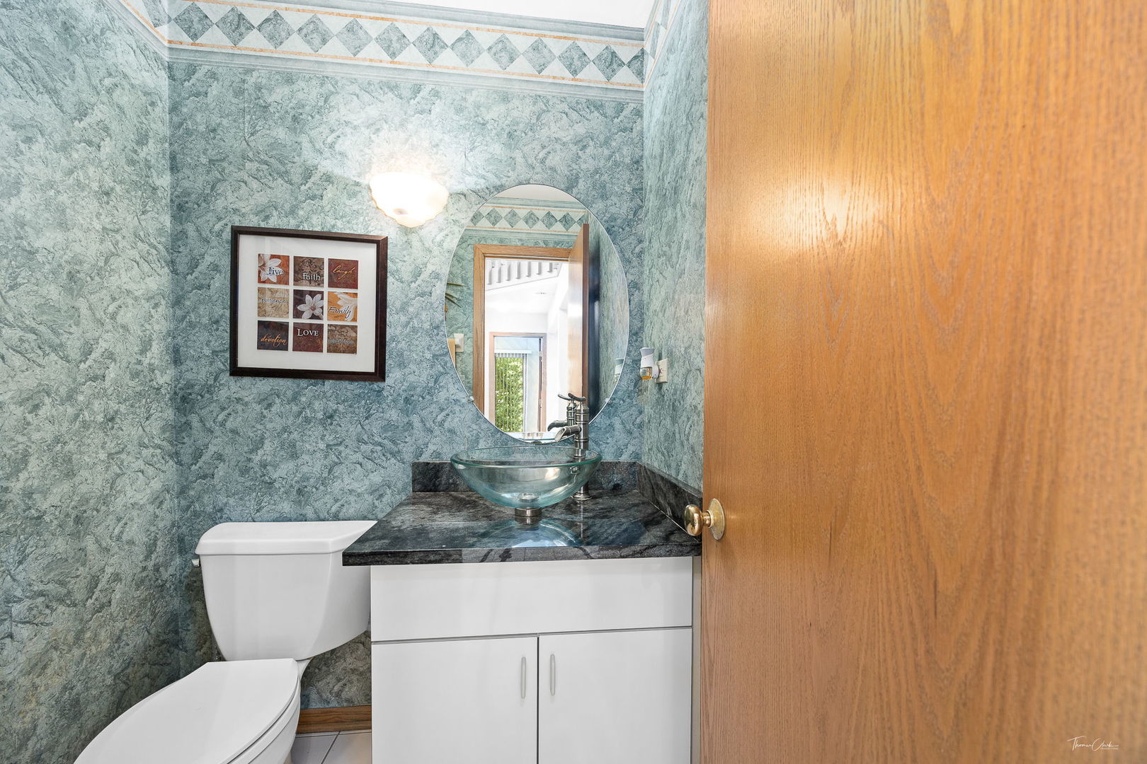 20 Geneva Court Crete, IL 60417 - Photo 16 of 34 a bathroom with a toilet a sink and mirror