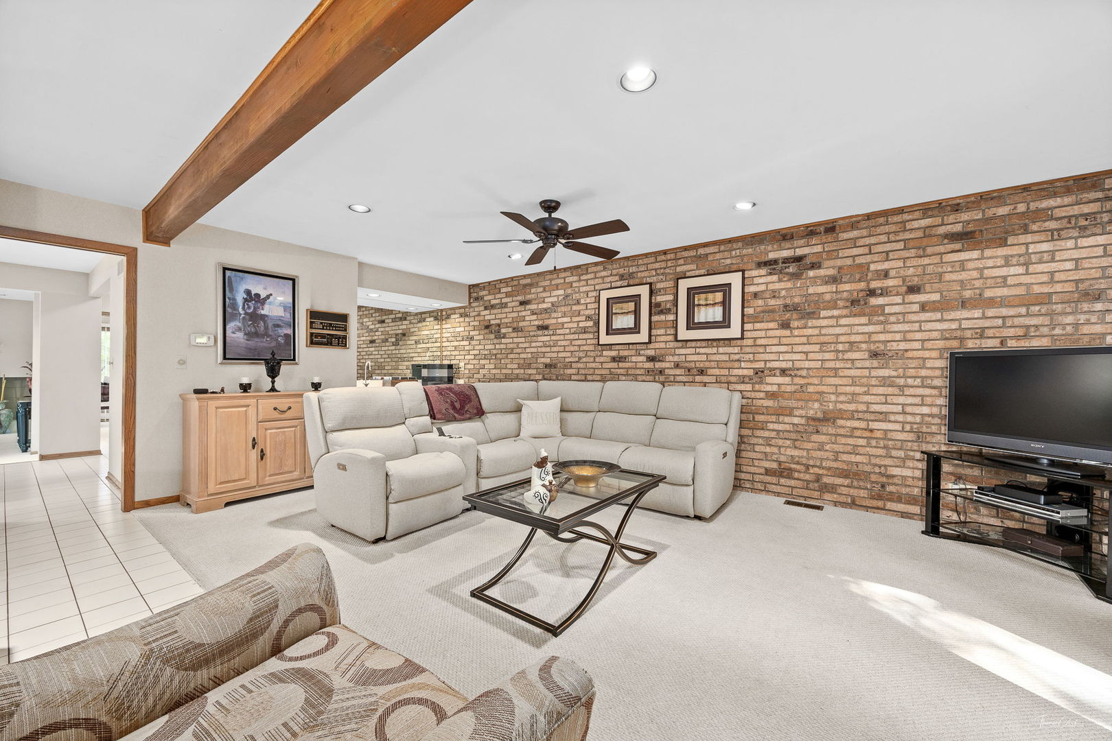 20 Geneva Court Crete, IL 60417 - Photo 20 of 34 a living room with furniture and a flat screen tv