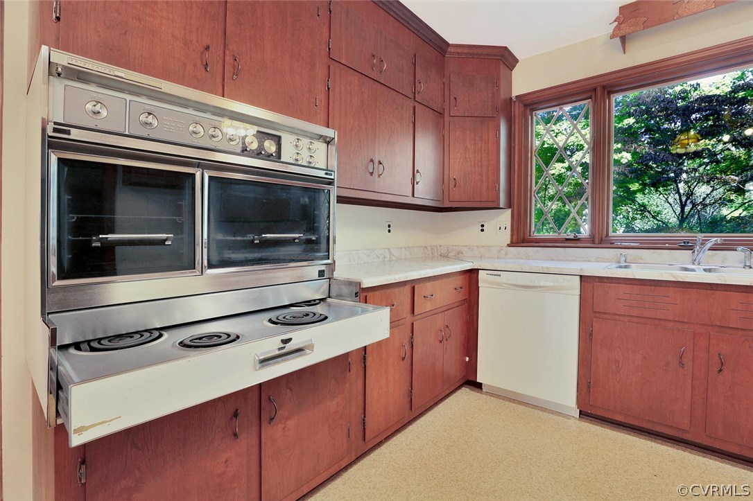 2421 Kings Lynn Road Midlothian, VA 23113 - Photo 11 of 31 a kitchen with granite countertop a stove microwave and sink