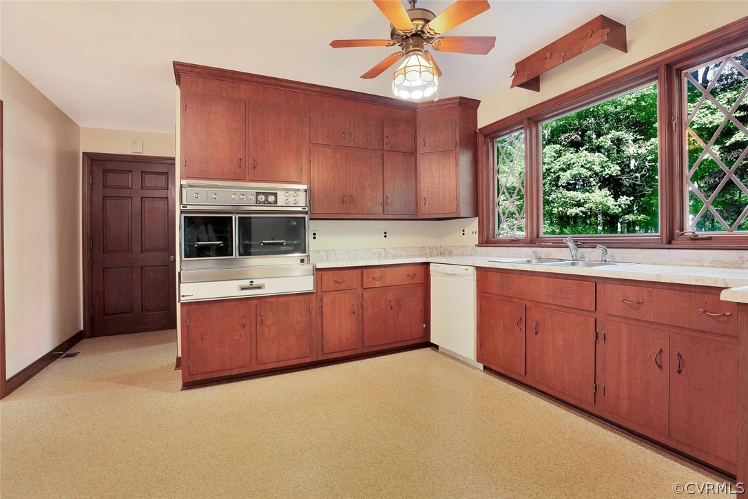 2421 Kings Lynn Road Midlothian, VA 23113 - Photo 13 of 31 a kitchen with stainless steel appliances granite countertop a stove a sink dishwasher and a microwave oven with cabinets