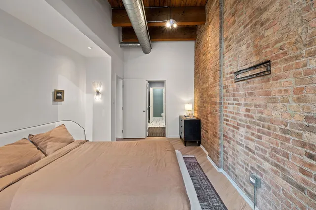 a bedroom with a bed and a walk in closet