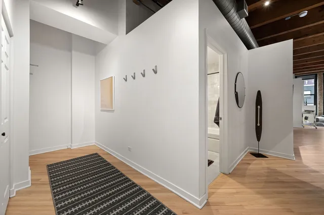 a view of room with window and wooden floor