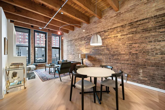 a dining room with furniture and window