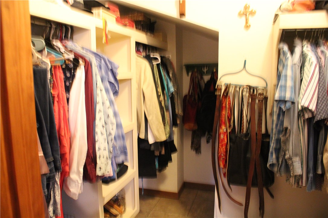 2210 Weiterer Road Scranton, AR 72863 - Photo 28 of 49 Custom closet system featuring multiple hanging rods and integrated shelving units