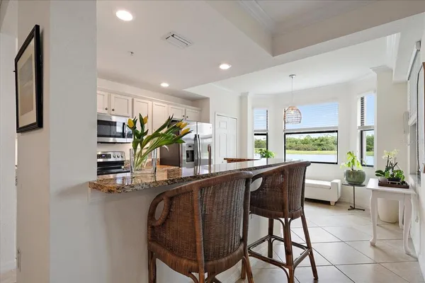 a dining room with furniture and window