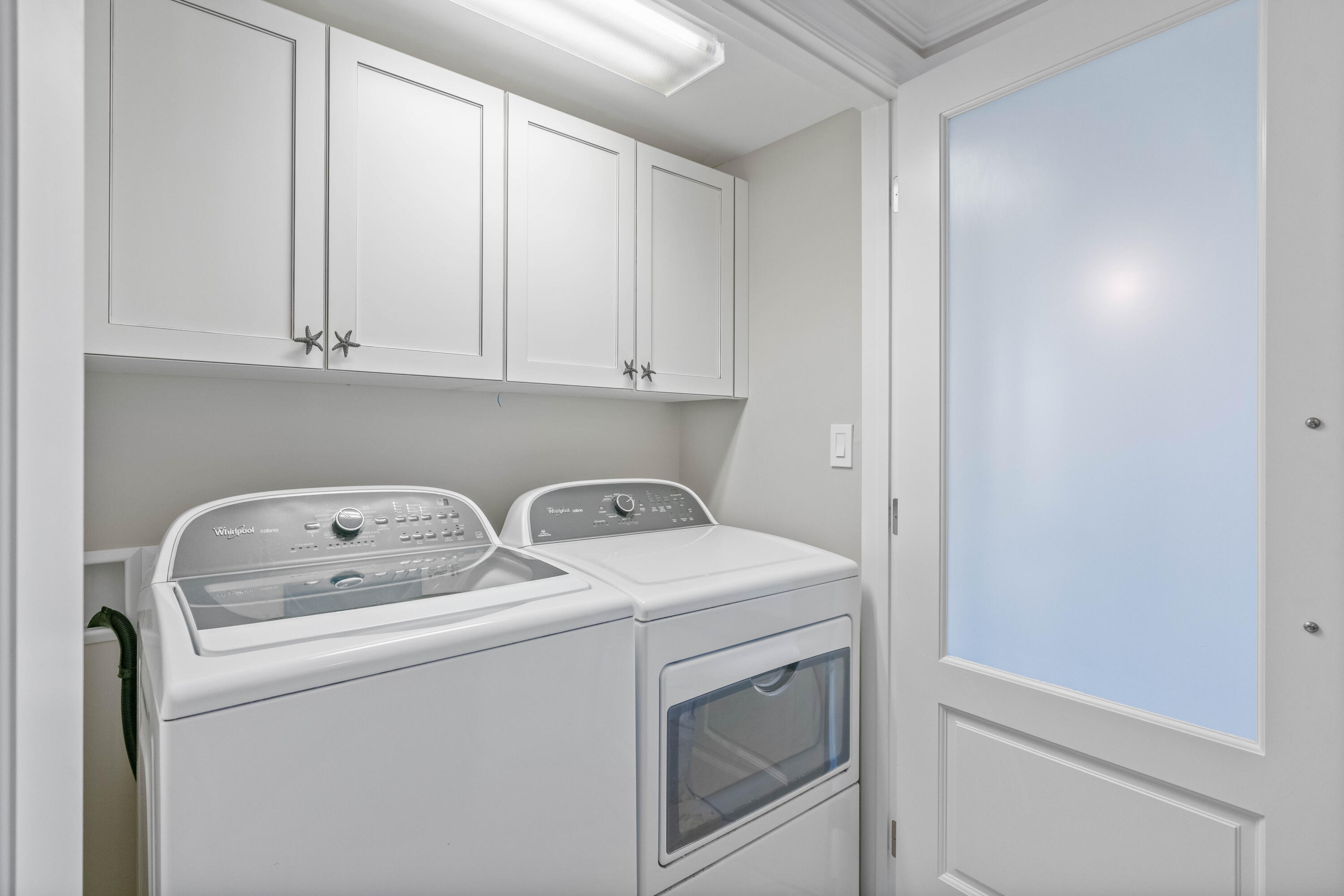 2000 Florida A1A, Unit 406 Jupiter, FL 33477 - Photo 26 of 40 a utility room with dryer and washer