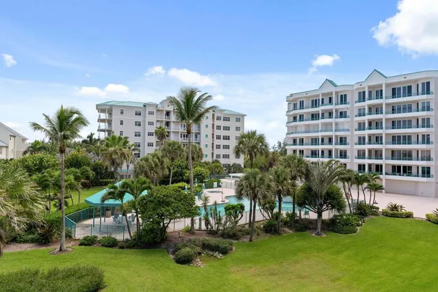 a view of house with outdoor space and swimming pool