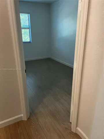 a bathroom with a sink vanity and mirror