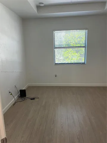 a bathroom with a sink a mirror and a shower