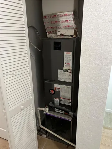 a view of an empty room and a door