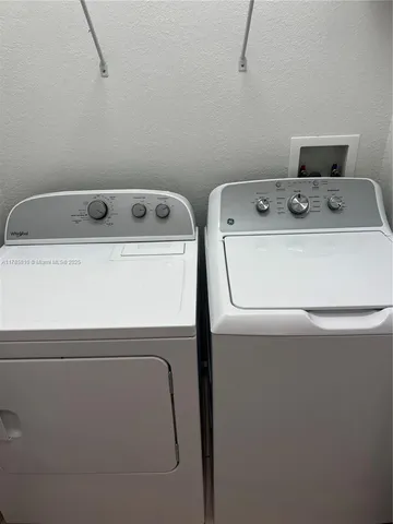 an empty room with wooden floor and entrance