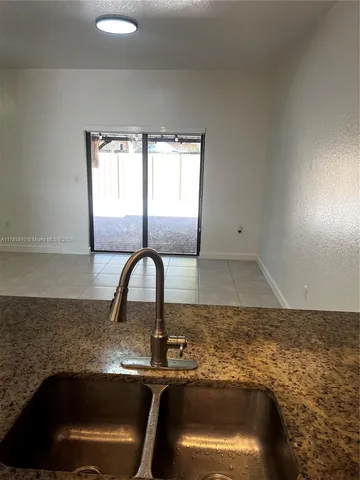 a bathroom with a sink and a window