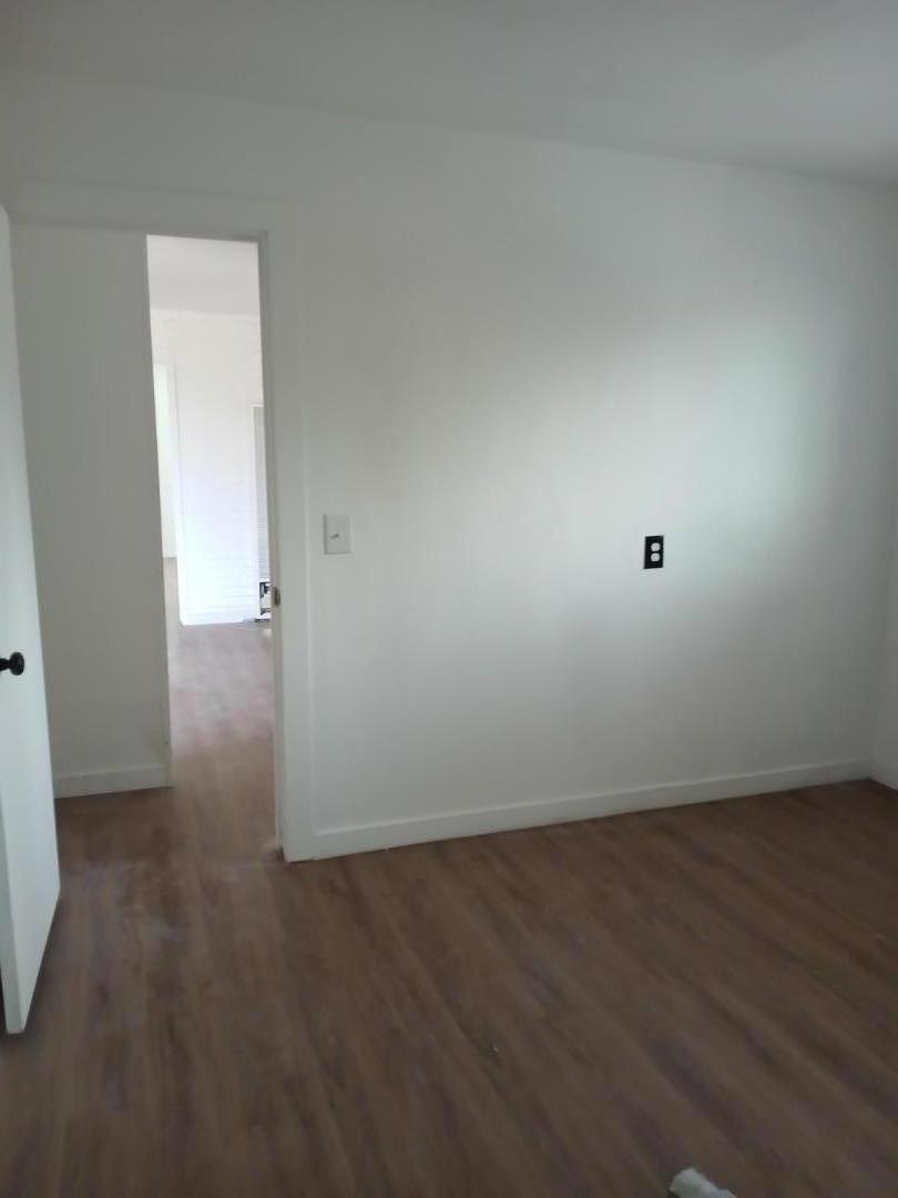 665 West Tyler Island Bridge Road Isleton, CA 95641 - Photo 13 of 19 an empty room with wooden floor