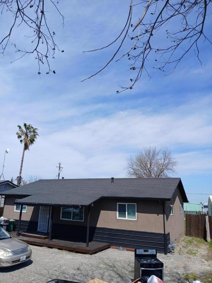 665 West Tyler Island Bridge Road Isleton, CA 95641 - Photo 2 of 19 a front view of a house with a yard