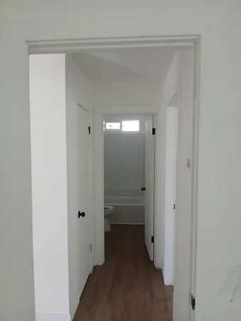 a view of a hallway with an empty room