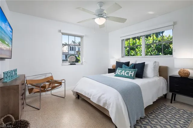 a bedroom with bed and a window