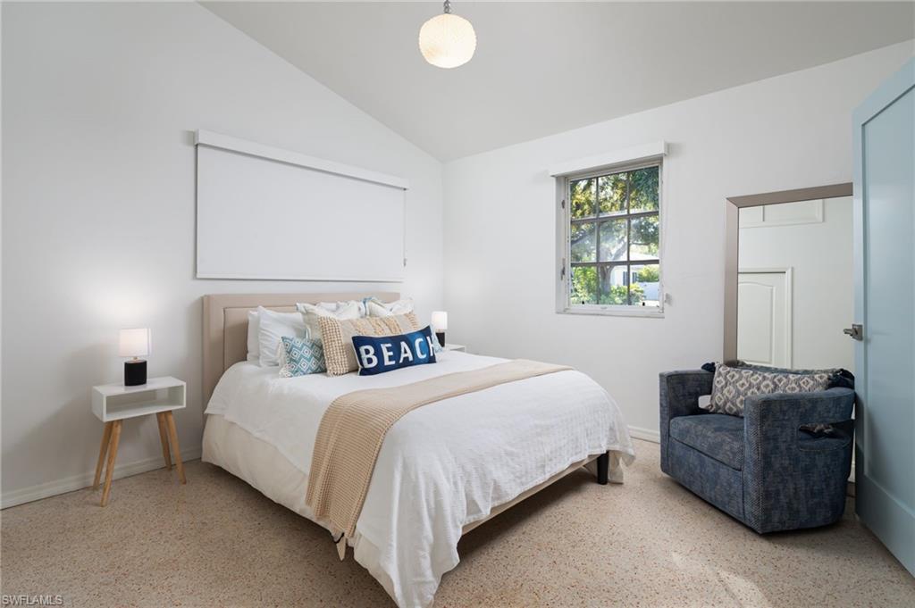 339 4th Avenue North Naples, FL 34102 - Photo 20 of 48 a bedroom with a bed and window