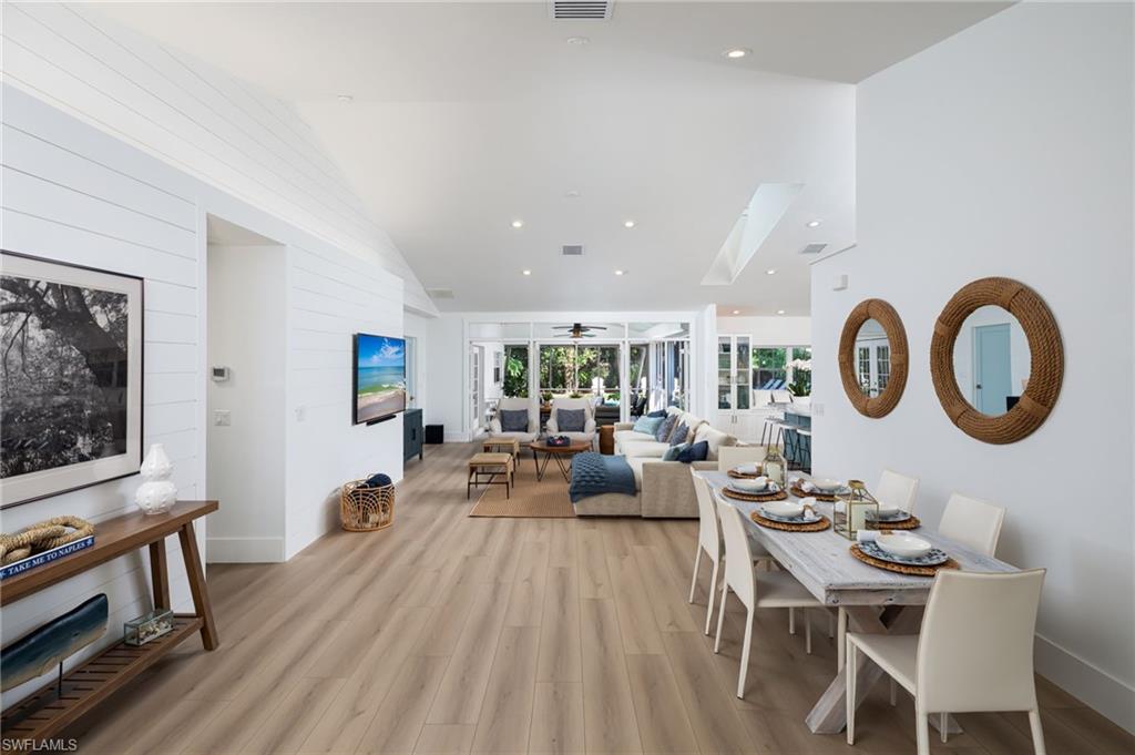 339 4th Avenue North Naples, FL 34102 - Photo 26 of 48 a living room with furniture and a flat screen tv