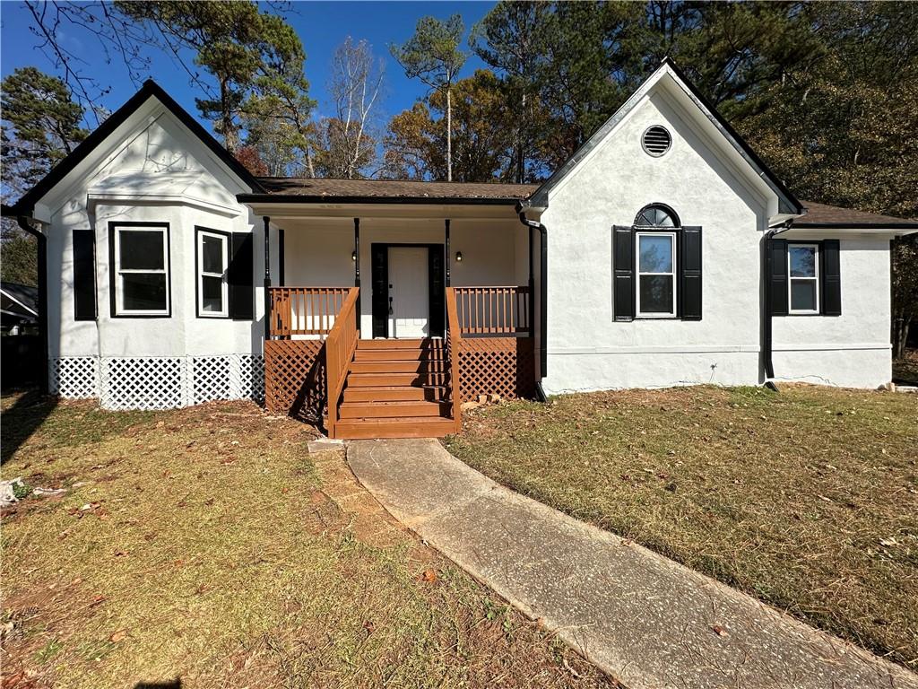 646 Hunt Station Drive Lawrenceville, GA 30044 - Photo 1 of 1 a front view of a house with a yard
