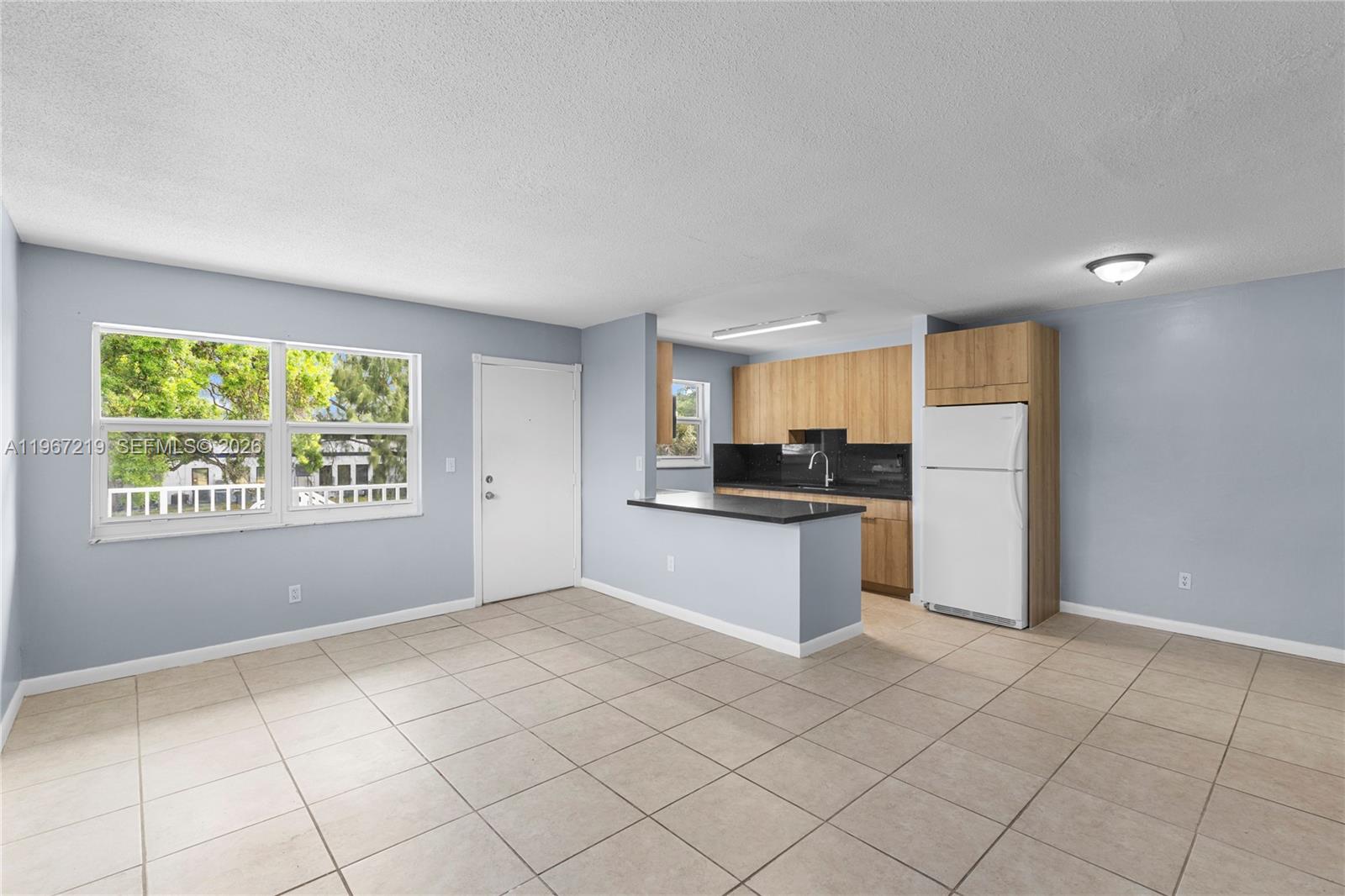 3265 Griffin Road, Unit 206 Dania Beach, FL 33312 - Photo 5 of 15 a large white kitchen with a stove a sink dishwasher and a refrigerator