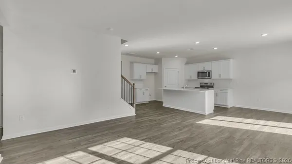 a view of kitchen with wooden floor