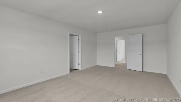 a view of an empty room and entryway