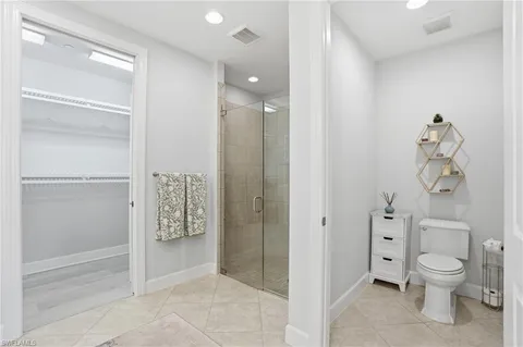 a bathroom with a shower and a toilet
