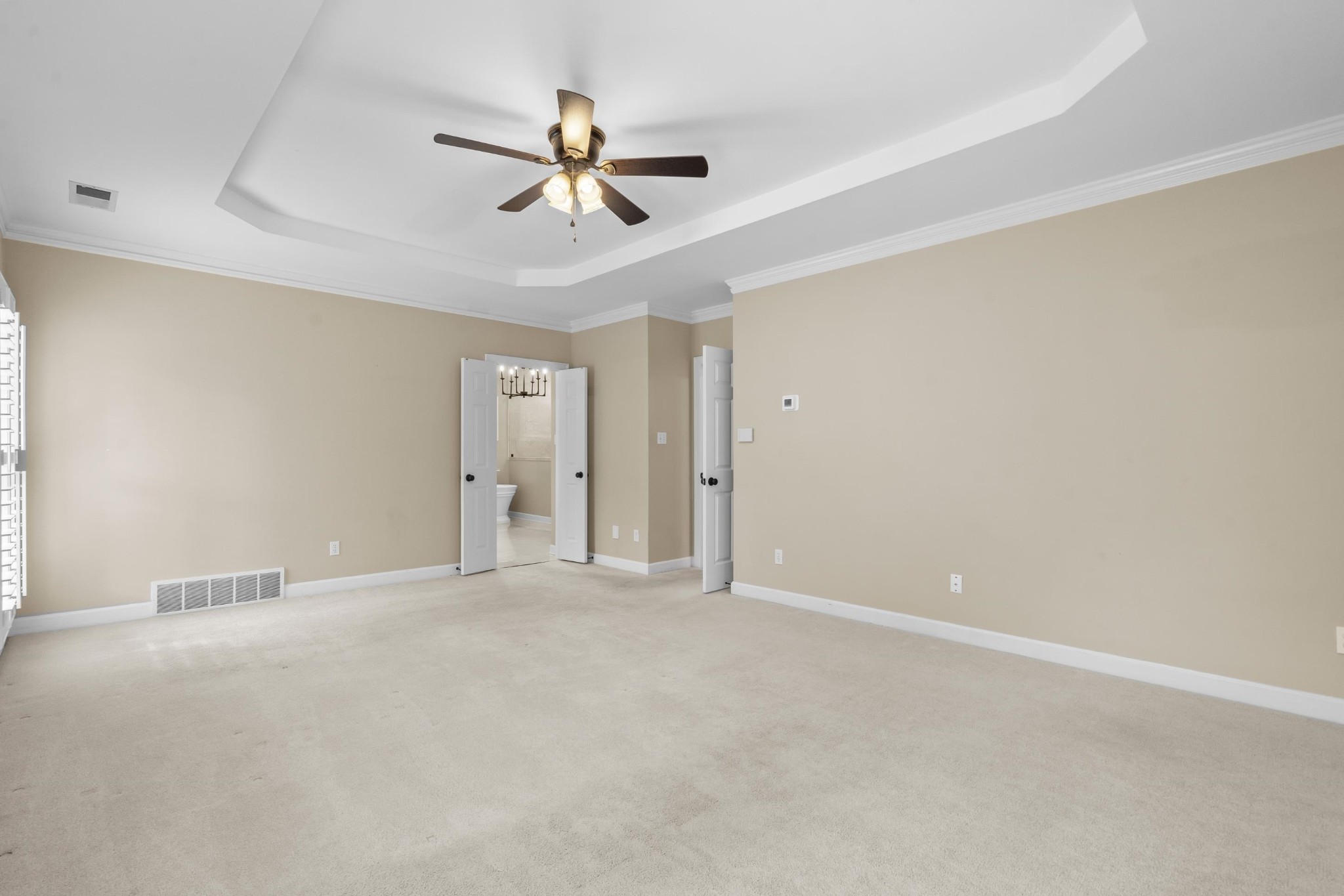 927 Oakmont Ridge Cove Collierville, TN 38017 - Photo 17 of 40 a view of an empty room with chandelier fan