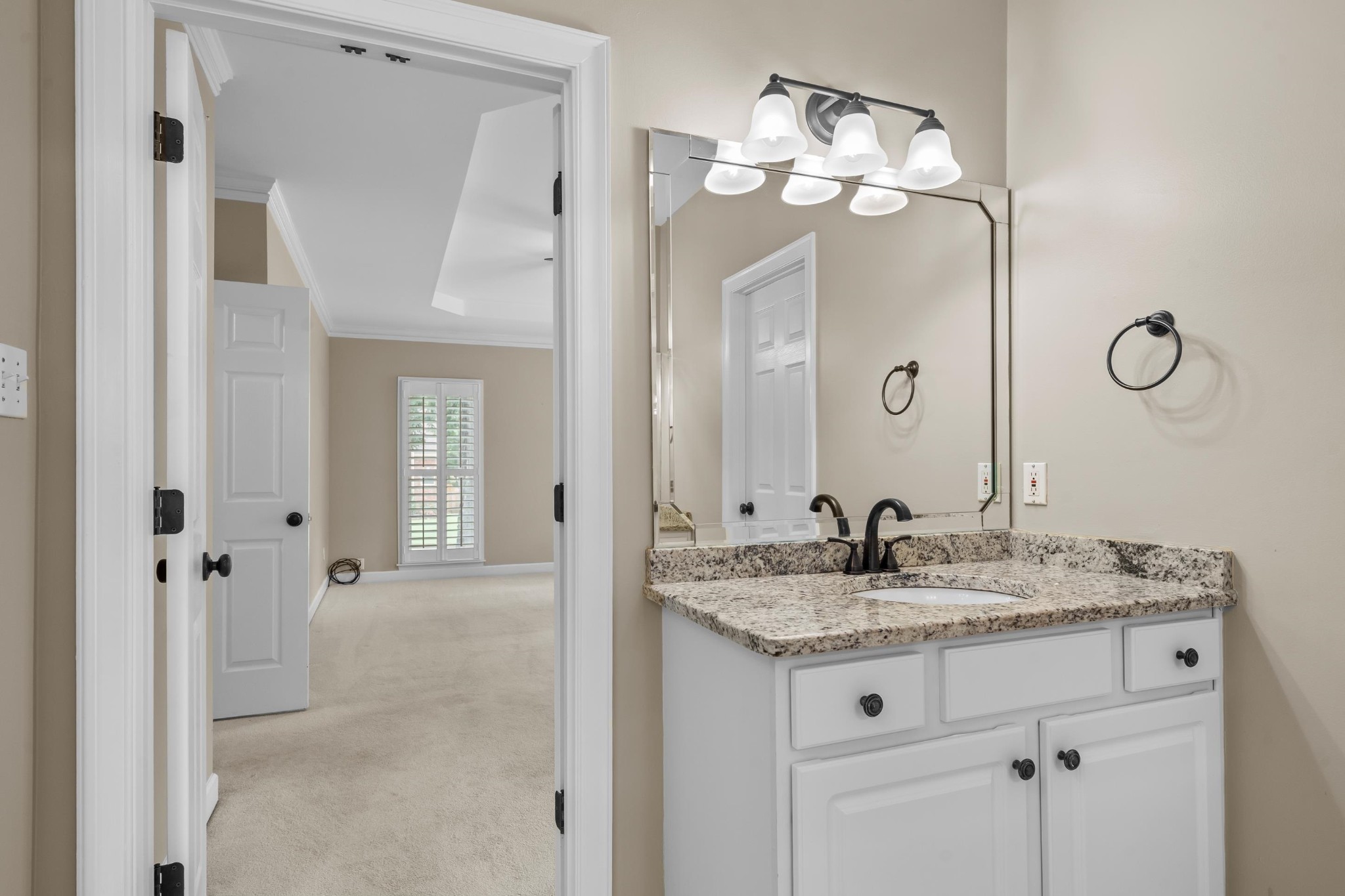 927 Oakmont Ridge Cove Collierville, TN 38017 - Photo 20 of 40 a bathroom with a granite countertop sink a mirror and a shower
