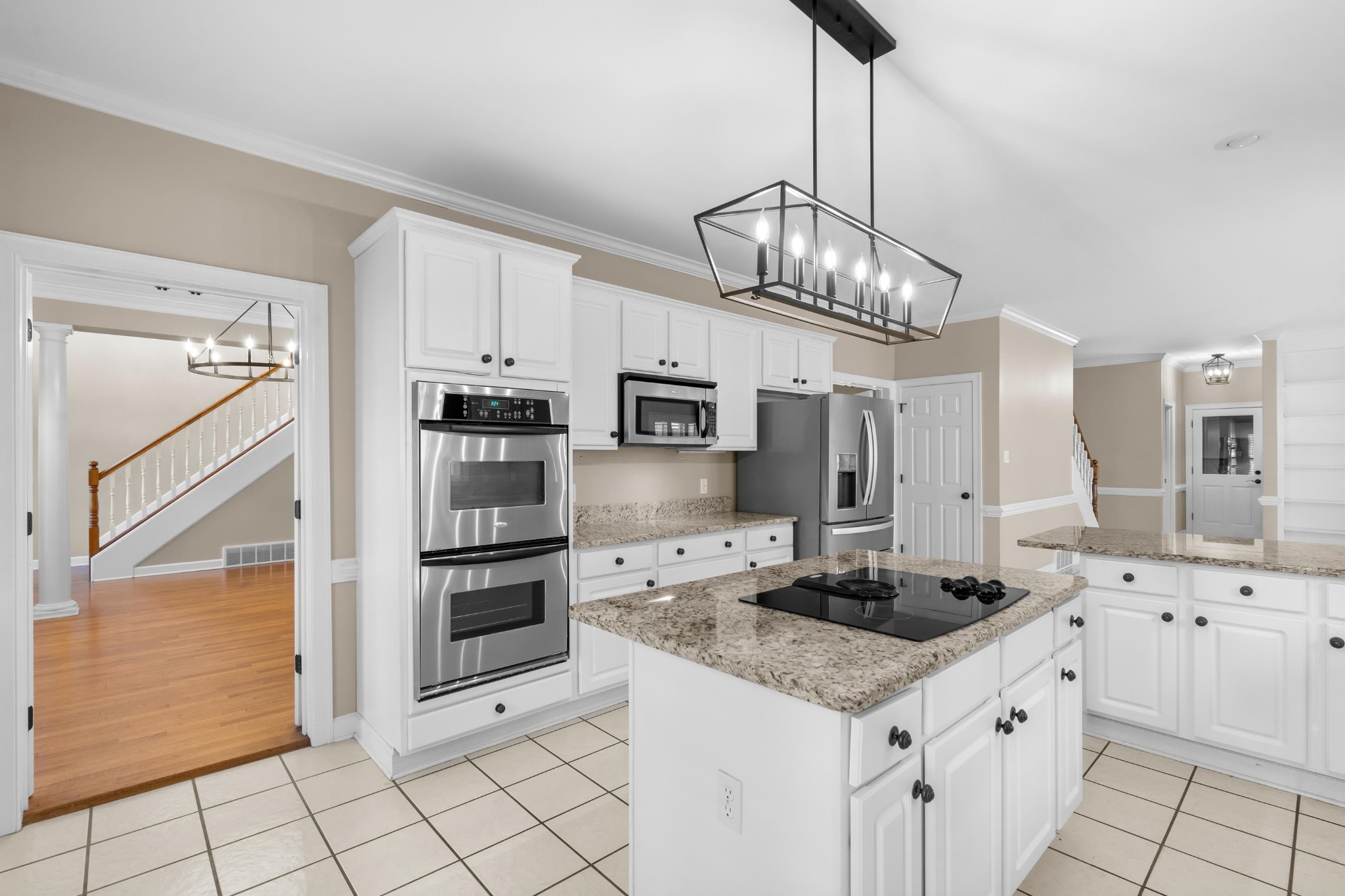 927 Oakmont Ridge Cove Collierville, TN 38017 - Photo 2 of 40 a kitchen with stainless steel appliances granite countertop a sink and cabinets