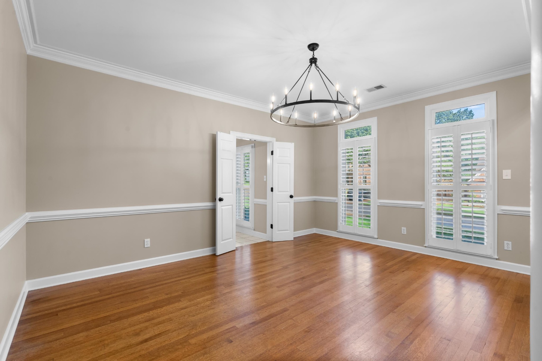 927 Oakmont Ridge Cove Collierville, TN 38017 - Photo 10 of 40 a view of wooden floor and windows in a room