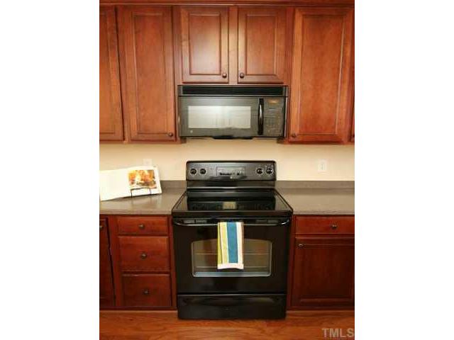 4613 All Points View Way Raleigh, NC 27614 - Photo 10 of 25 Well maintained range and microwave. Chef's in!
