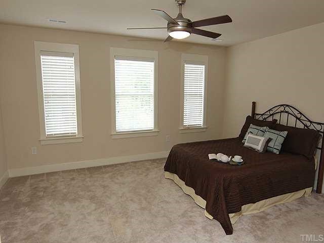 4613 All Points View Way Raleigh, NC 27614 - Photo 11 of 25 The spacious master bedroom easily accommodates a king-sized bed.