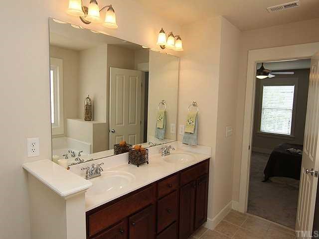4613 All Points View Way Raleigh, NC 27614 - Photo 13 of 25 The master bath features dual vanities.