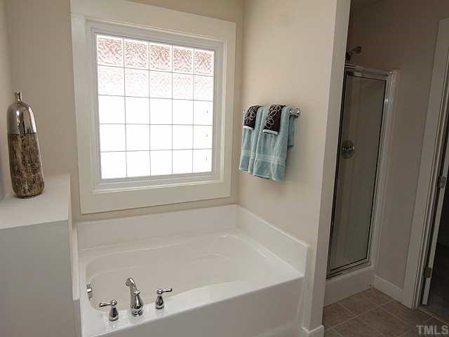 4613 All Points View Way Raleigh, NC 27614 - Photo 14 of 25 The master bath also features a lovely garden tub.