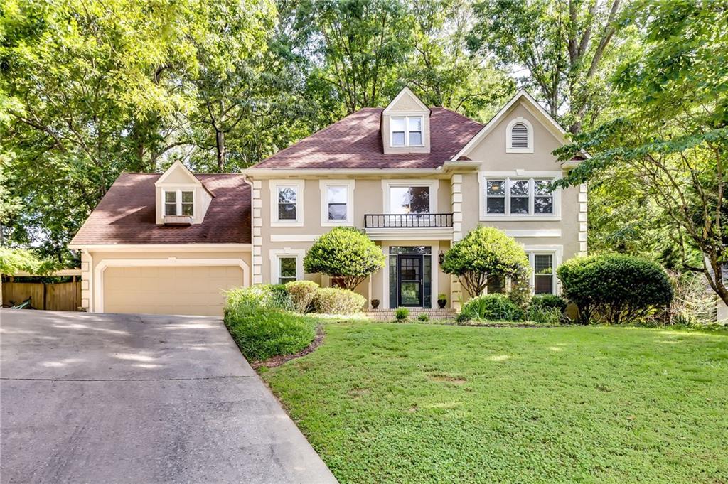 2128 Line Tree Lane Powder Springs, GA 30127 - Photo 1 of 1 a front view of a house with a yard and garage