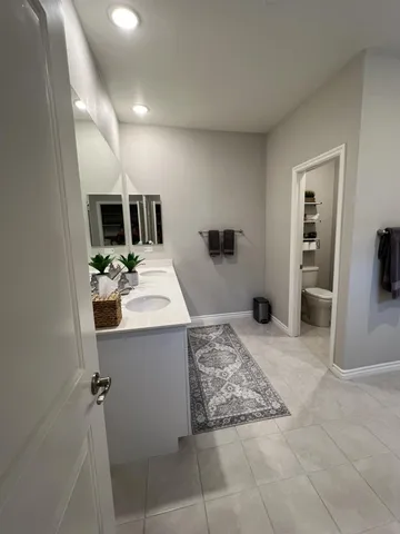 a bathroom with a shower and a glass door