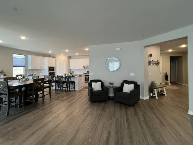 a view of a dining room with furniture window and wooden floor