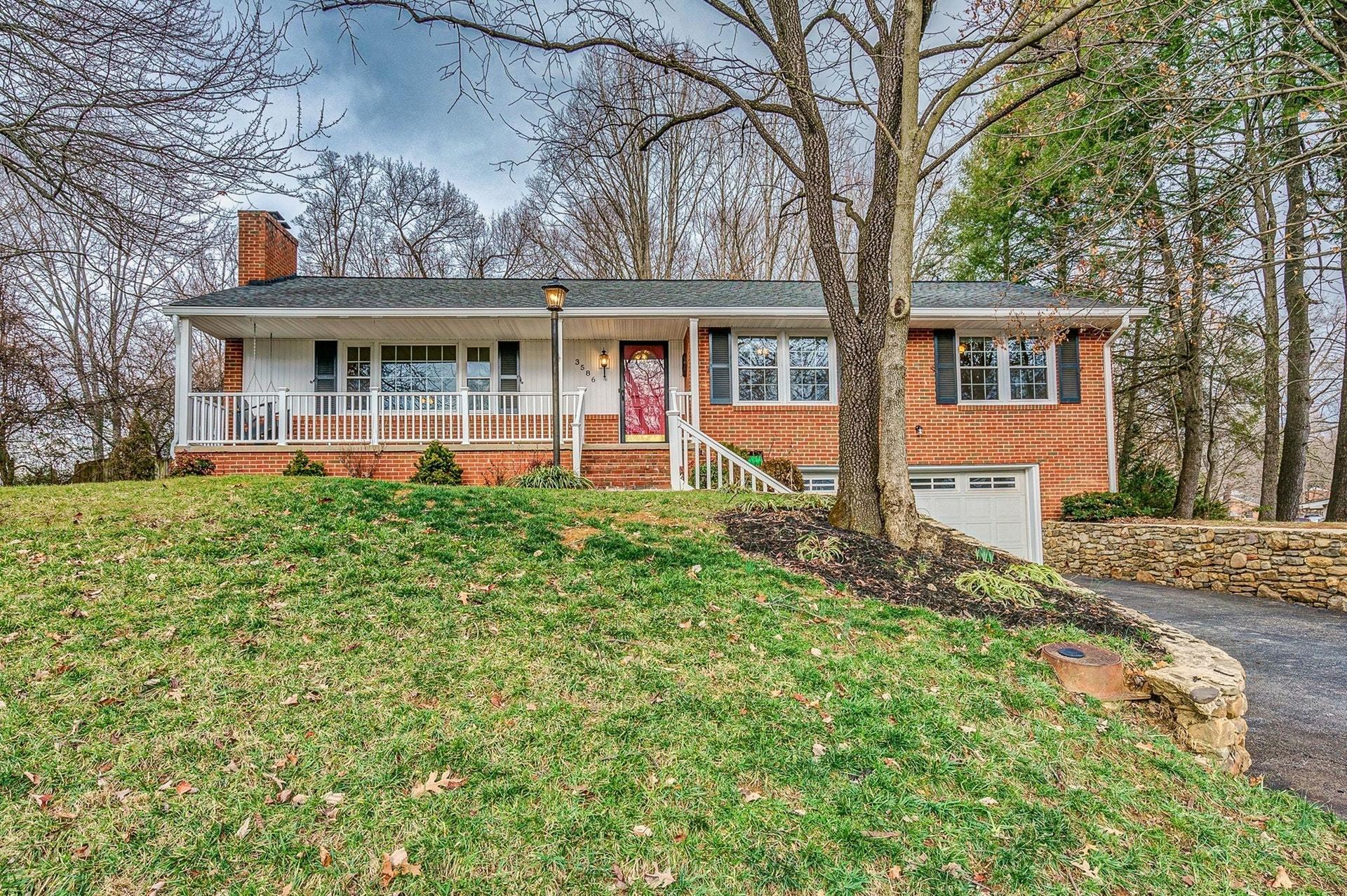 3586 Forester Road Southwest Roanoke, VA 24018 - Photo 1 of 51 a front view of a house with garden