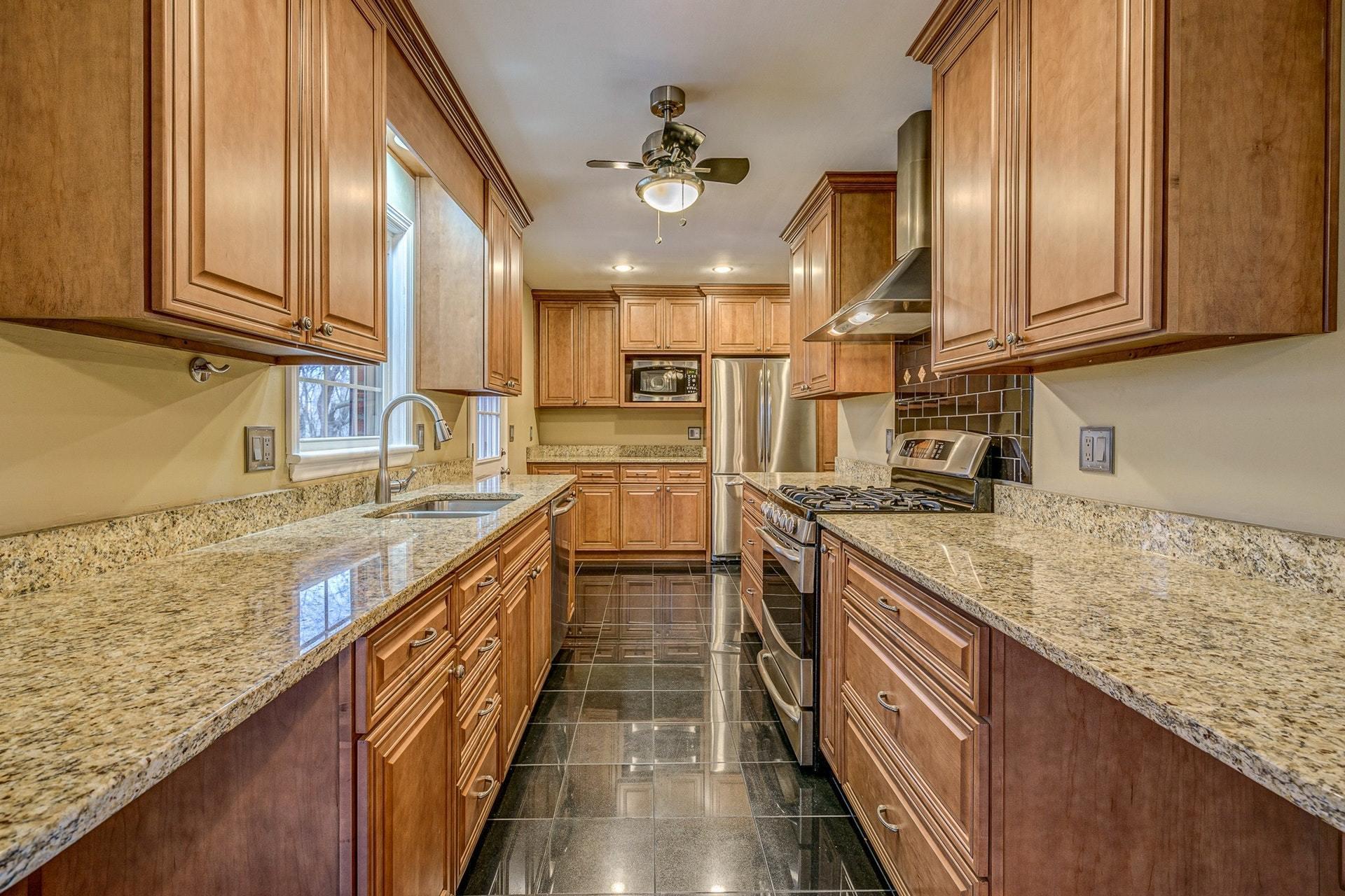 3586 Forester Road Southwest Roanoke, VA 24018 - Photo 13 of 51 a kitchen with stainless steel appliances granite countertop sink stove and cabinets