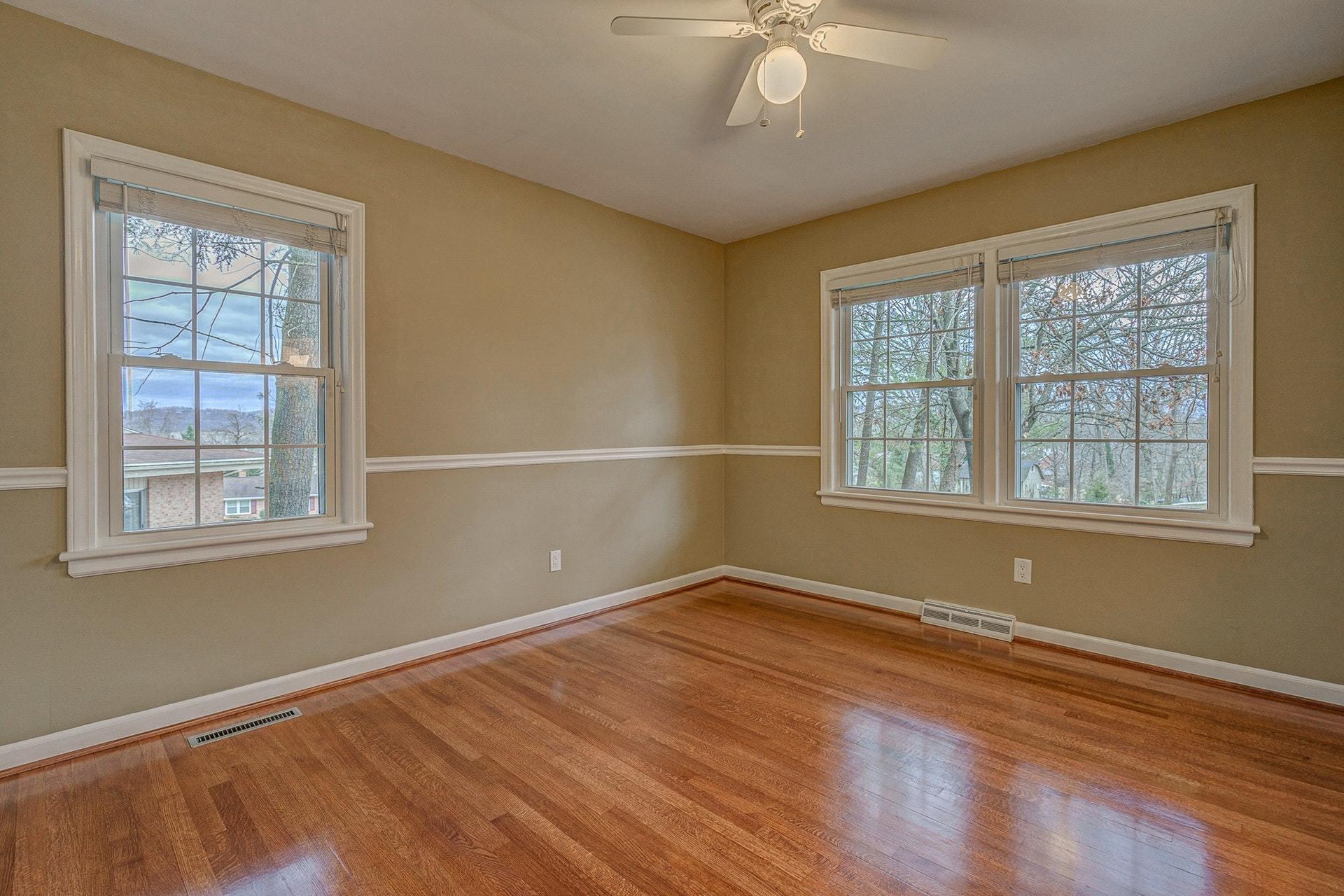 3586 Forester Road Southwest Roanoke, VA 24018 - Photo 21 of 51 a view of an empty room with wooden floor and a window