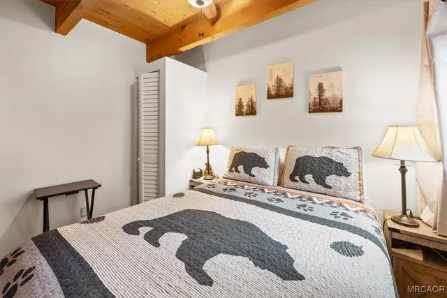 a bathroom with a sink toilet a mirror and shower