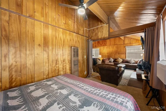 a bedroom with a bed and wall painting