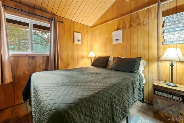 a bathroom with a sink a toilet and shower curtain